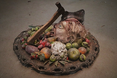 Dish   with a Head and  Axe