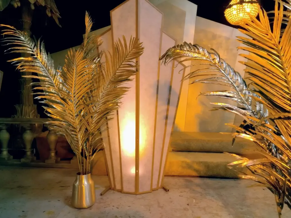 Gold palm leafs in a vase