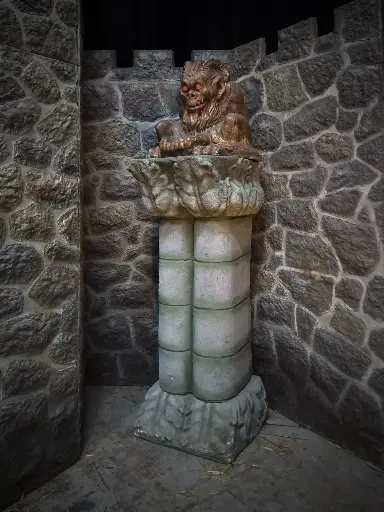 Devilish Figure on a double Column
