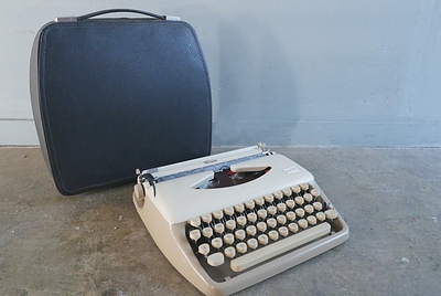 Typewriter  "Triumph"  in Leather Case